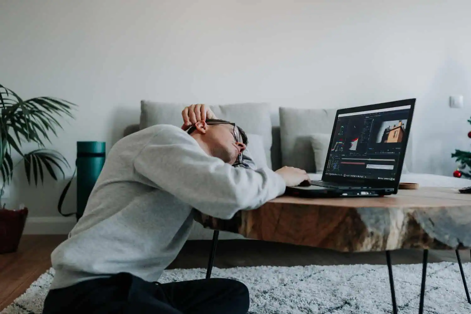 Bored man taking a nap instead of working, concept of boredom