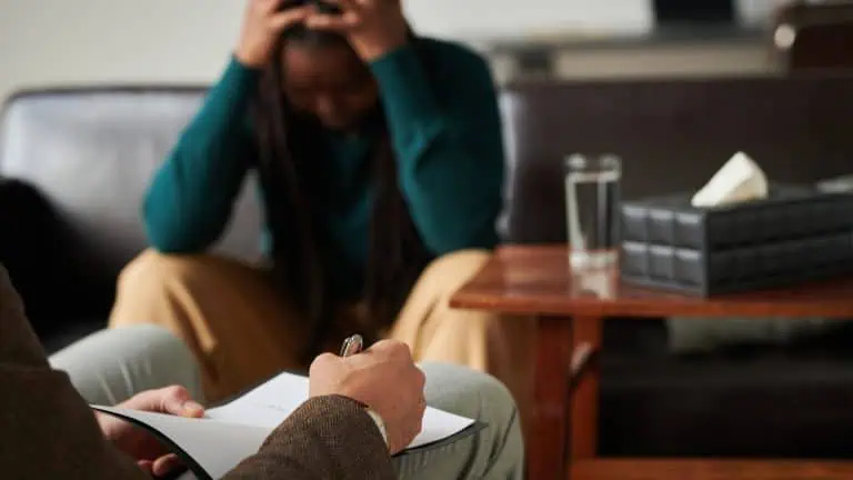 Psychotherapist making notes during consultation