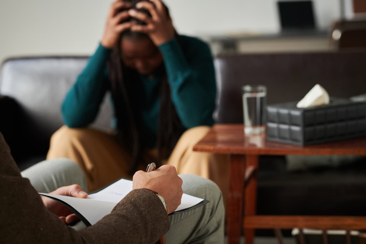 Psychotherapist making notes during consultation