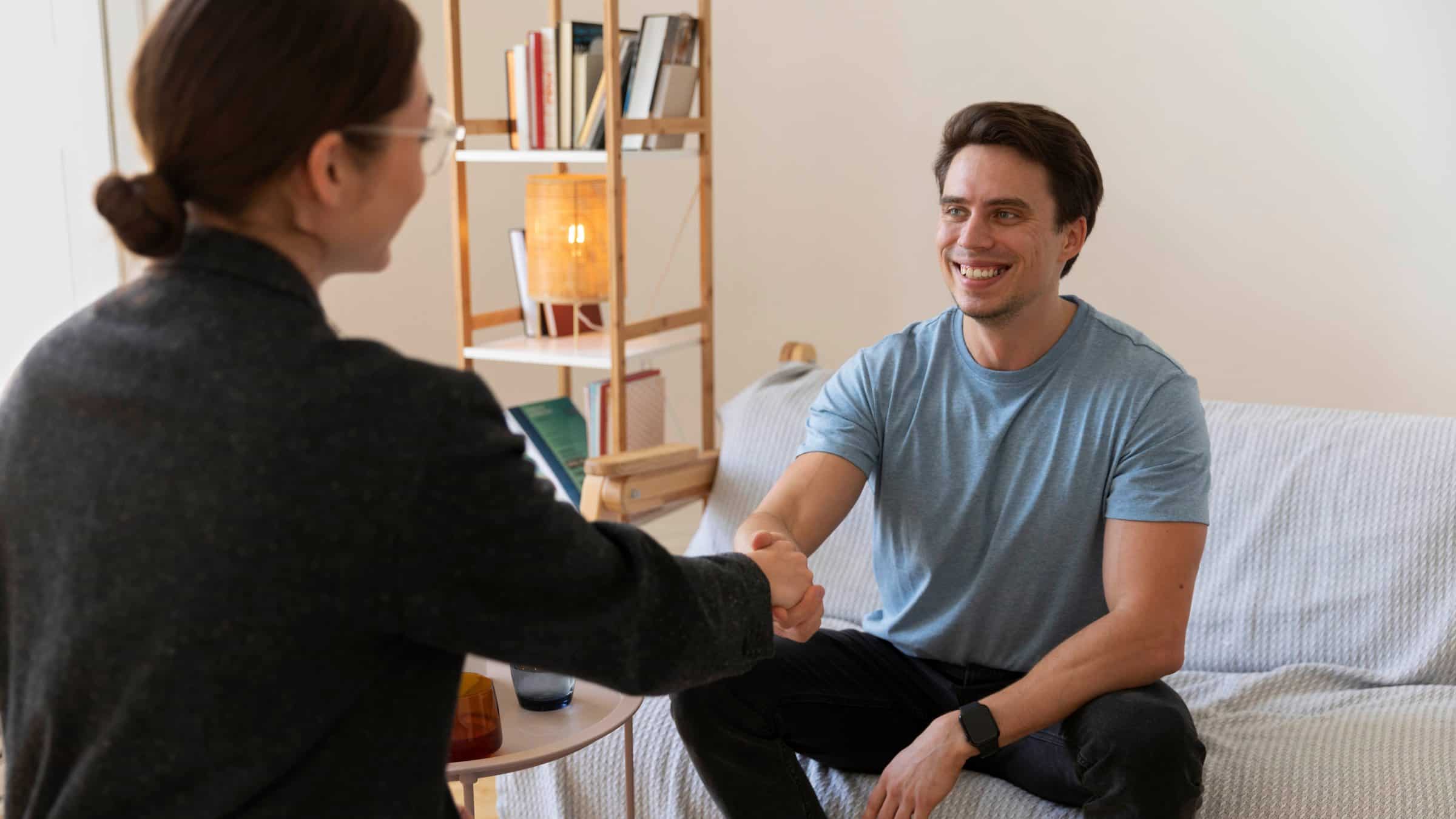 A man greets his therapist during burnout treatment in Toronto.