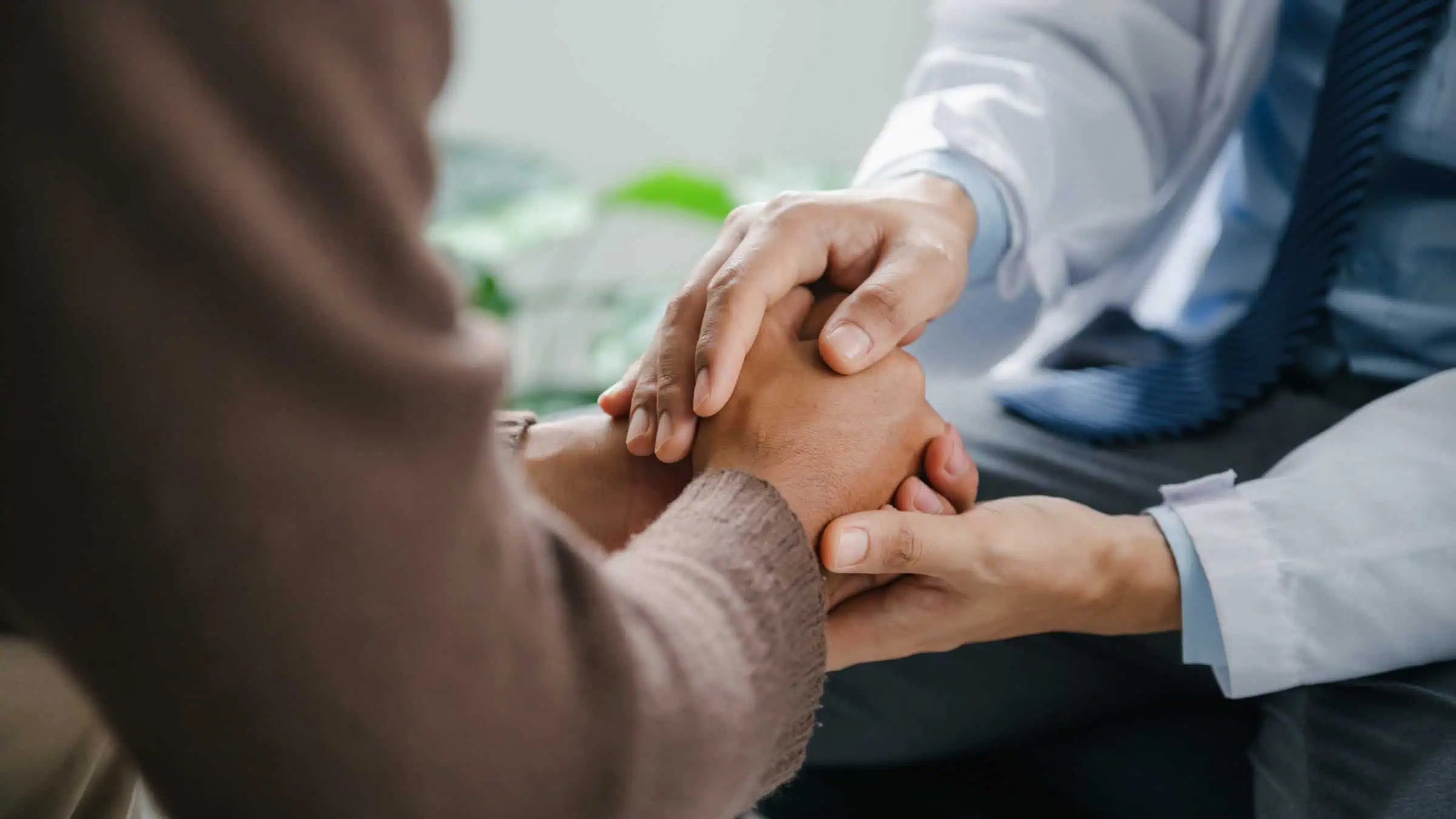 A professional offering support to a client during burnout treatment in Toronto.