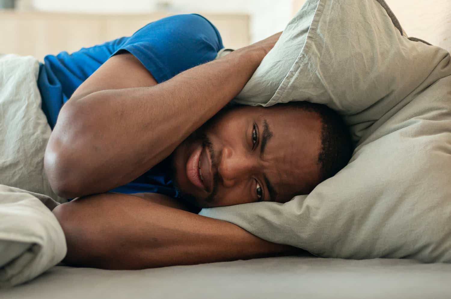 adult man looking exhausted from lack of sleep, concept of insomnia or sleeping problems