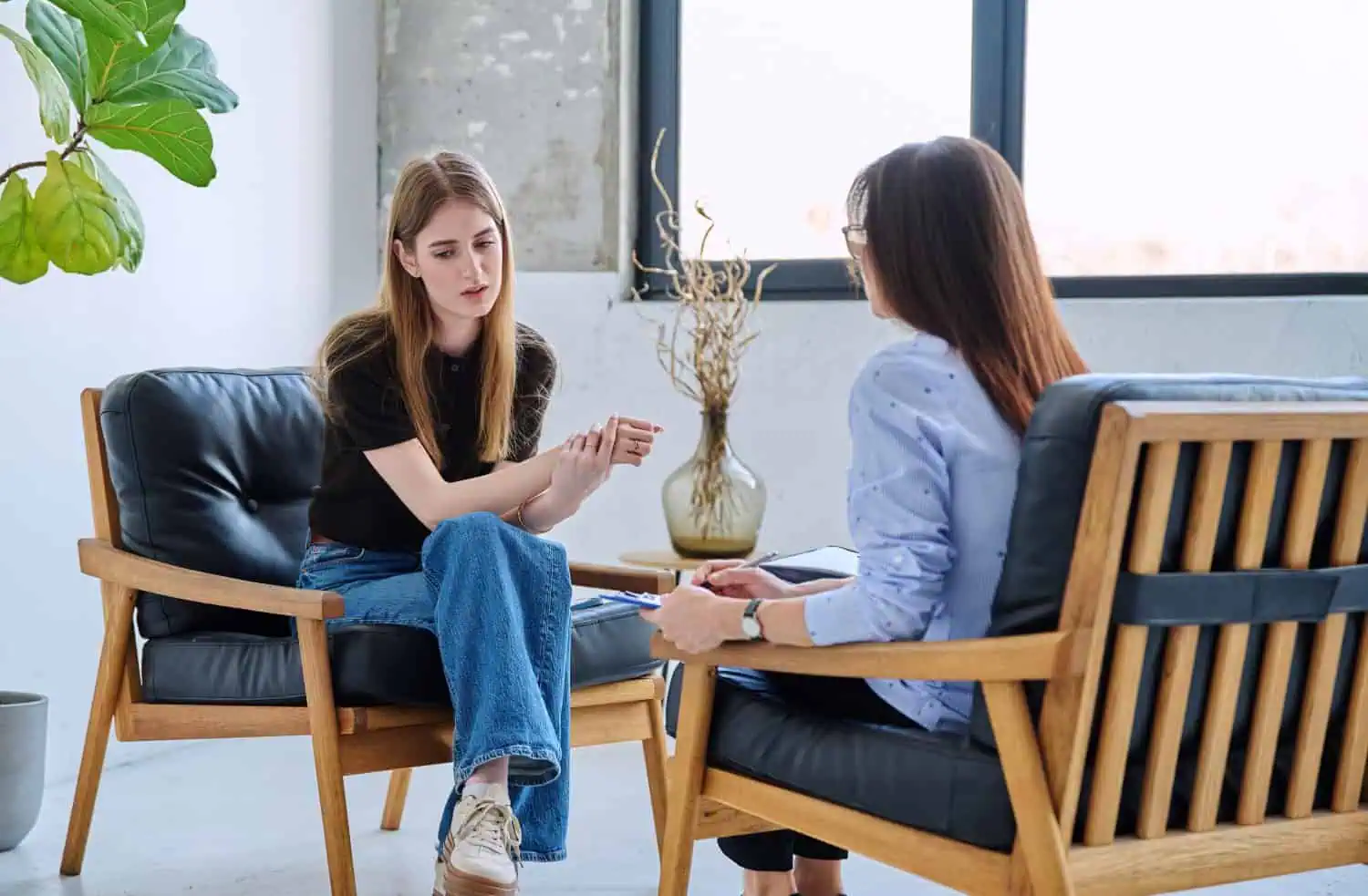 girl in session in office of professional psychologist, therapist