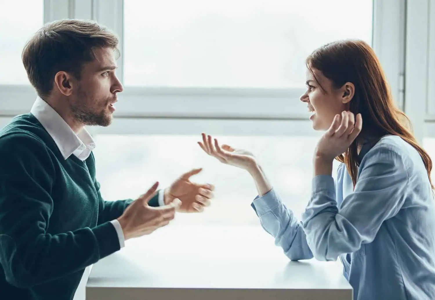 heated argument between a man and a woman at work