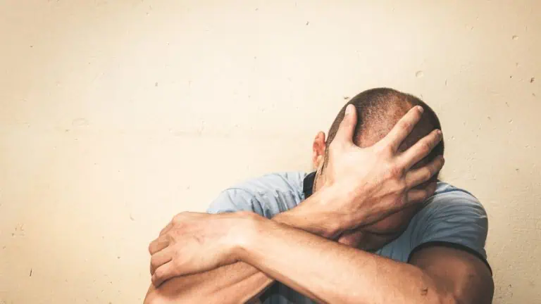 image of a man staring down, concept of depression and addiction