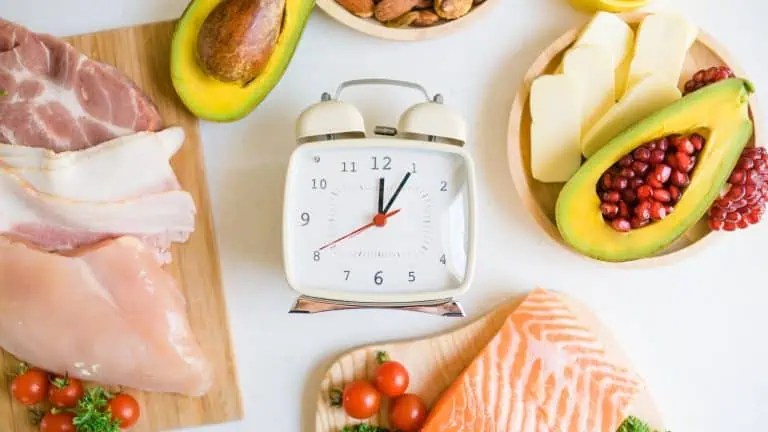 image of healthy foods with a clock in the middle, concept of eating healthy and on time, nutrition