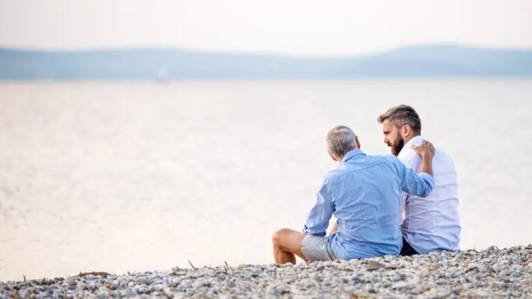 rear view of father and son talking to each other, concept of talking to someone about rehab