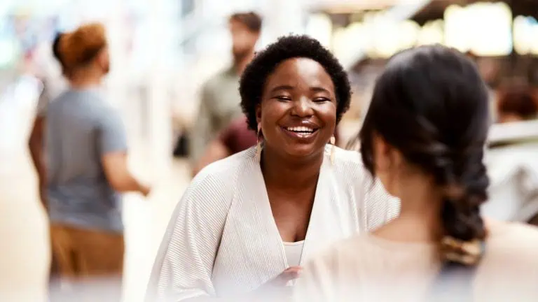 smiling woman, concept of developing connections after rehab