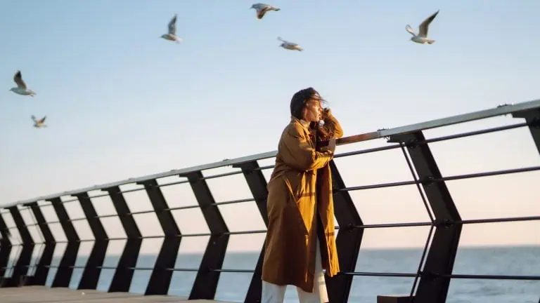 woman standing alone outdoors, concept of isolation depression deep thinking